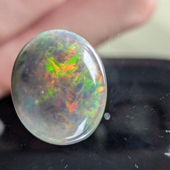 5.85ct Natural play of color black opal - Picture 14 of 16